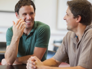 Two young men under discussion